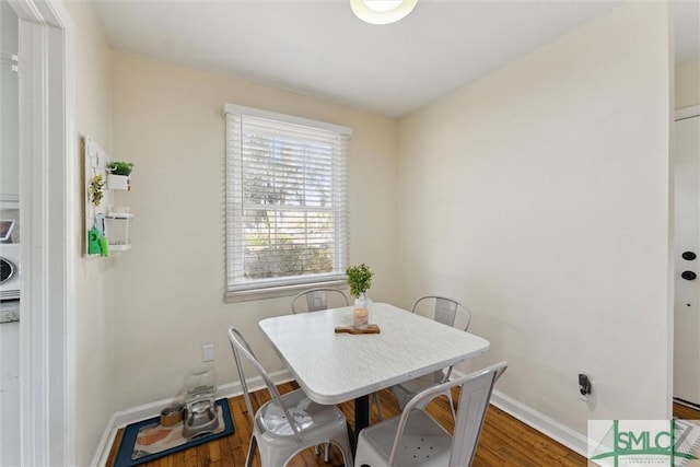 dining room with dark hardwood / wood-style flooring