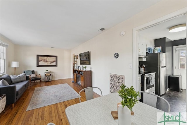 dining area featuring dark hardwood / wood-style floors