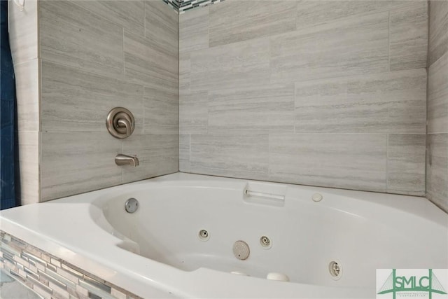 bathroom featuring a relaxing tiled tub