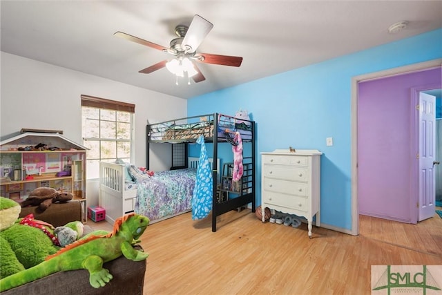 bedroom featuring ceiling fan and light hardwood / wood-style floors