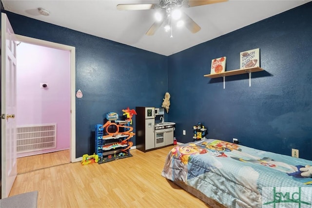 bedroom featuring wood-type flooring and ceiling fan