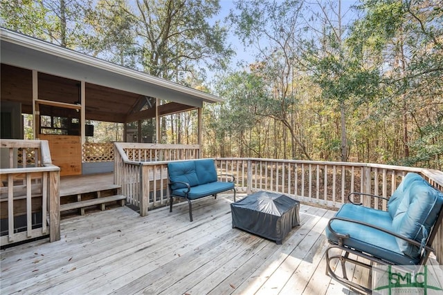 wooden terrace featuring an outdoor living space