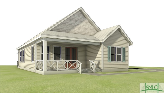 511 Goodman Dr, Midway, GA 31320 - back of house with covered porch and a lawn