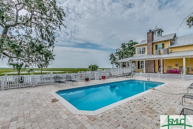 511 Goodman Dr, Midway, GA 31320 - view of swimming pool featuring a patio area and fence