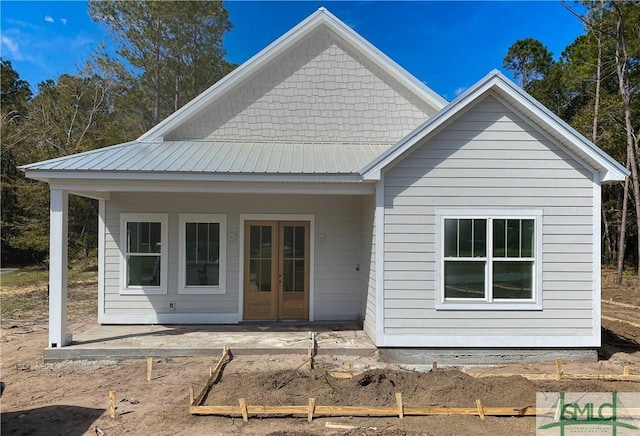 back of house featuring a patio area and french doors