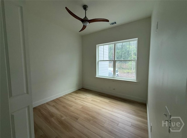 511 Goodman Dr, Midway, GA 31320 - empty room featuring wood finished floors, a ceiling fan, and baseboards