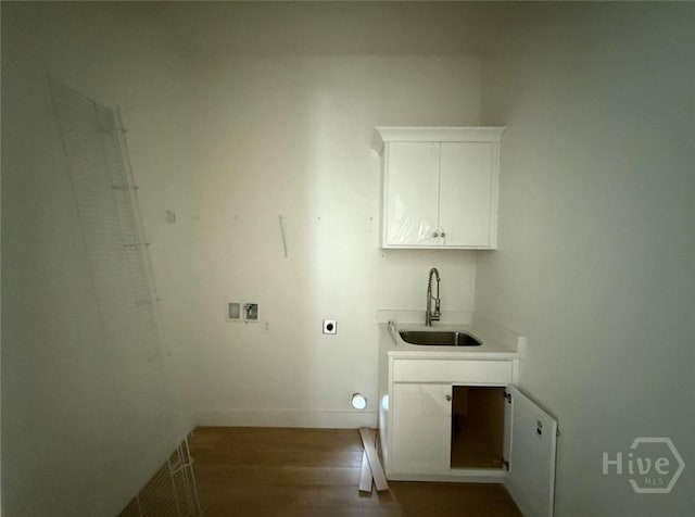 511 Goodman Dr, Midway, GA 31320 - clothes washing area featuring hookup for an electric dryer, dark wood-style floors, cabinet space, hookup for a washing machine, and baseboards