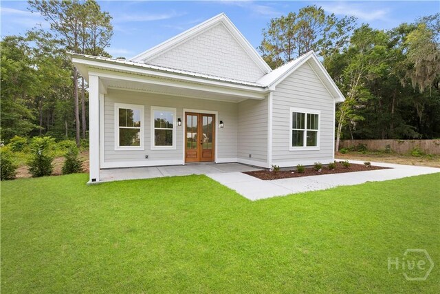 511 Goodman Dr, Midway, GA 31320 - view of front of property with french doors
