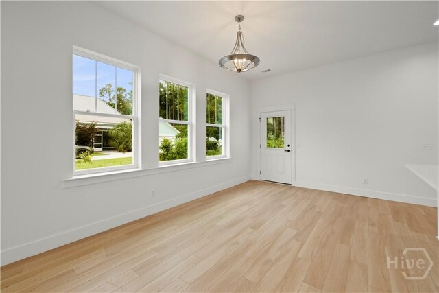 511 Goodman Dr, Midway, GA 31320 - unfurnished room featuring healthy amount of natural light, light wood-style flooring, and baseboards