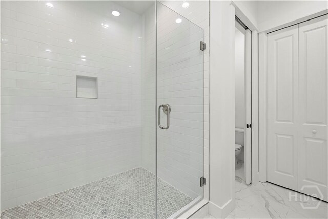 511 Goodman Dr, Midway, GA 31320 - bathroom featuring marble finish flooring, toilet, a shower stall, a closet, and recessed lighting