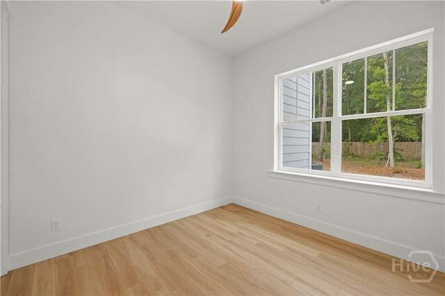 511 Goodman Dr, Midway, GA 31320 - unfurnished room with baseboards, a ceiling fan, and light wood-style floors