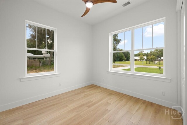 511 Goodman Dr, Midway, GA 31320 - unfurnished room with wood finished floors, baseboards, and a ceiling fan