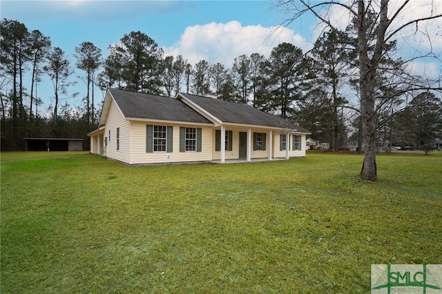 back of property featuring a lawn