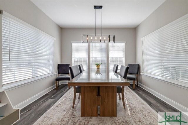 100 Sweetwater Cir, Rincon, GA 31326 - dining room featuring an inviting chandelier, plenty of natural light, and dark hardwood / wood-style flooring