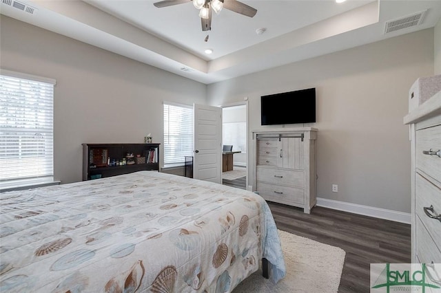 100 Sweetwater Cir, Rincon, GA 31326 - bedroom with ceiling fan, a tray ceiling, and dark hardwood / wood-style floors