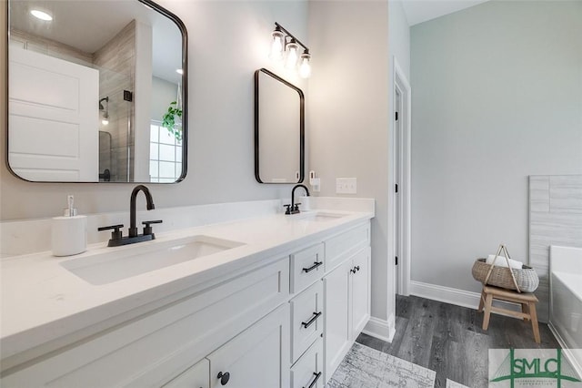 100 Sweetwater Cir, Rincon, GA 31326 - bathroom featuring vanity, plus walk in shower, and hardwood / wood-style floors