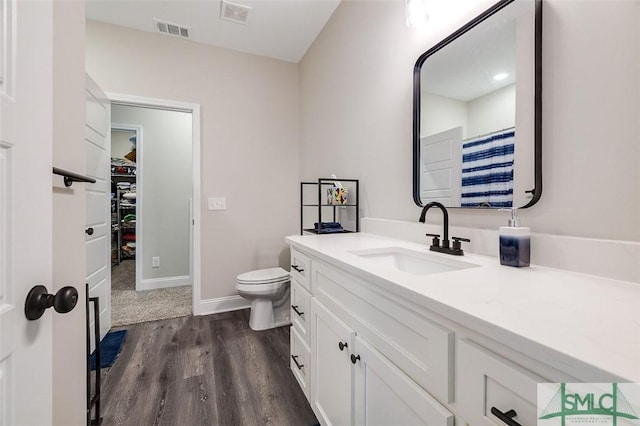 100 Sweetwater Cir, Rincon, GA 31326 - bathroom featuring hardwood / wood-style flooring, vanity, and toilet