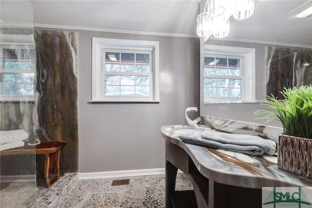 115 2nd Ave, Tybee Island, GA 31328 - bathroom featuring plenty of natural light, a chandelier, ornamental molding, and a shower
