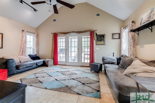 living room featuring french doors, ceiling fan, high vaulted ceiling, and light tile patterned floors