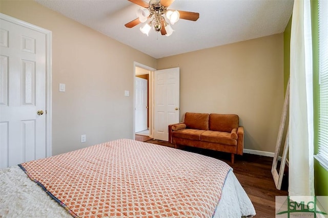 bedroom featuring ceiling fan and dark hardwood / wood-style floors