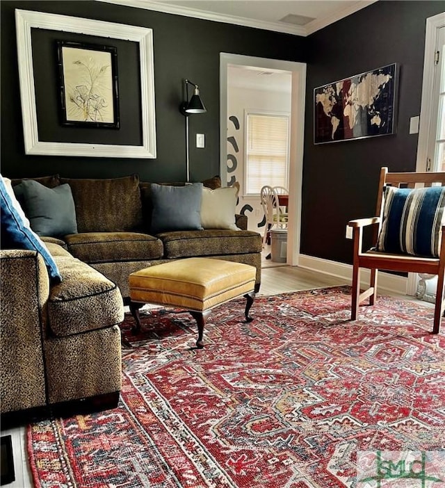 living room featuring crown molding and hardwood / wood-style flooring