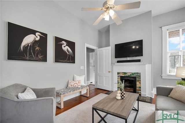 living room featuring hardwood / wood-style floors and ceiling fan