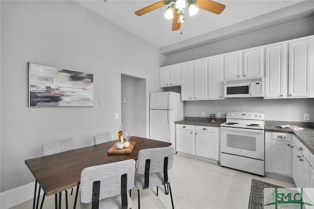 kitchen featuring white cabinetry, white appliances, light tile patterned flooring, and ceiling fan