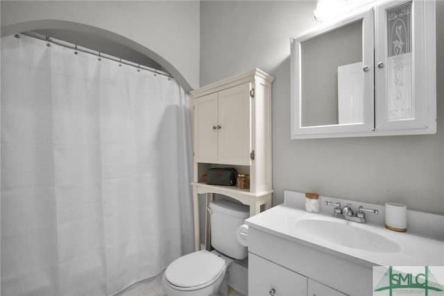 bathroom with vanity and toilet