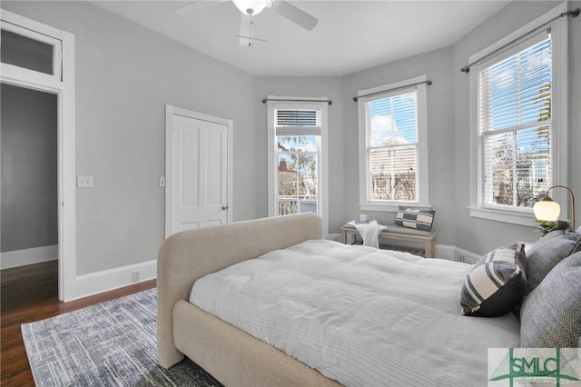 bedroom featuring dark hardwood / wood-style floors and ceiling fan