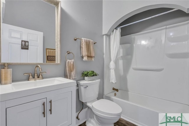 full bathroom featuring shower / tub combo, vanity, and toilet