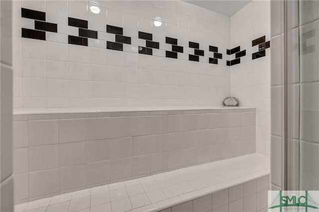 bathroom with tiled shower