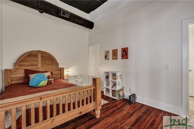 bedroom featuring dark wood-type flooring