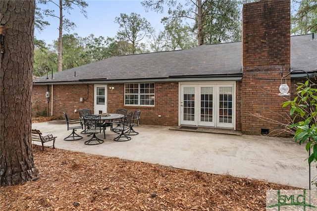 back of property with french doors and a patio area