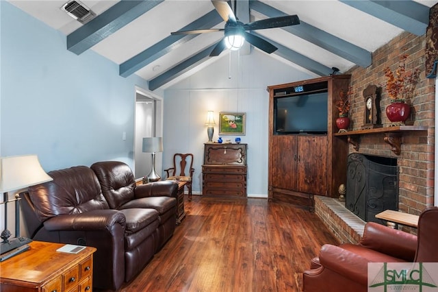 living room featuring dark wood-type flooring, ceiling fan, lofted ceiling with beams, and a brick fireplace