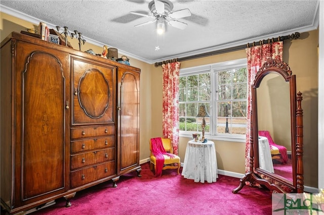 interior space with ornamental molding, carpet, ceiling fan, and a textured ceiling