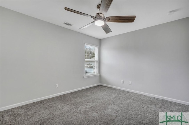 empty room with ceiling fan and carpet