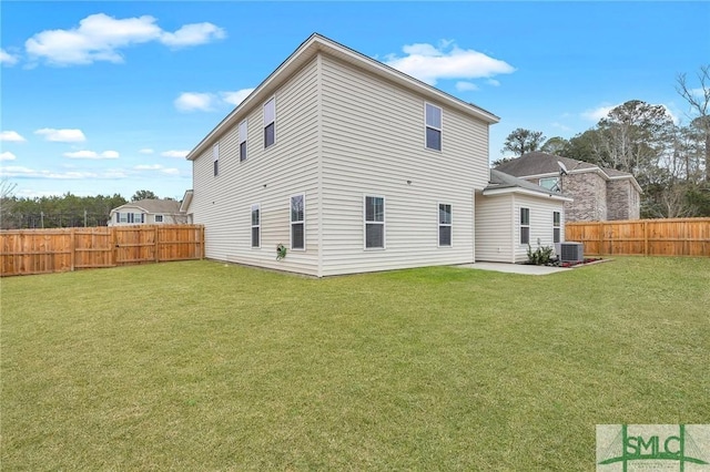 back of house with central AC, a patio, and a lawn