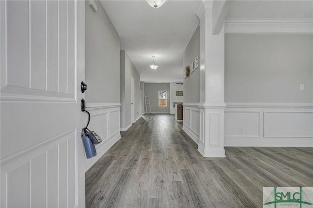 entrance foyer with light wood-type flooring and ornate columns