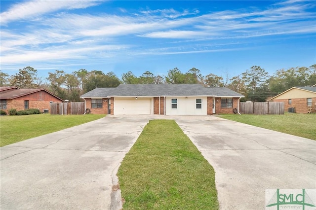 ranch-style house featuring a garage and a front yard