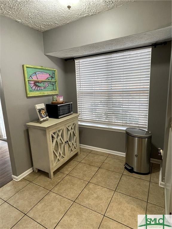 interior space with a textured ceiling