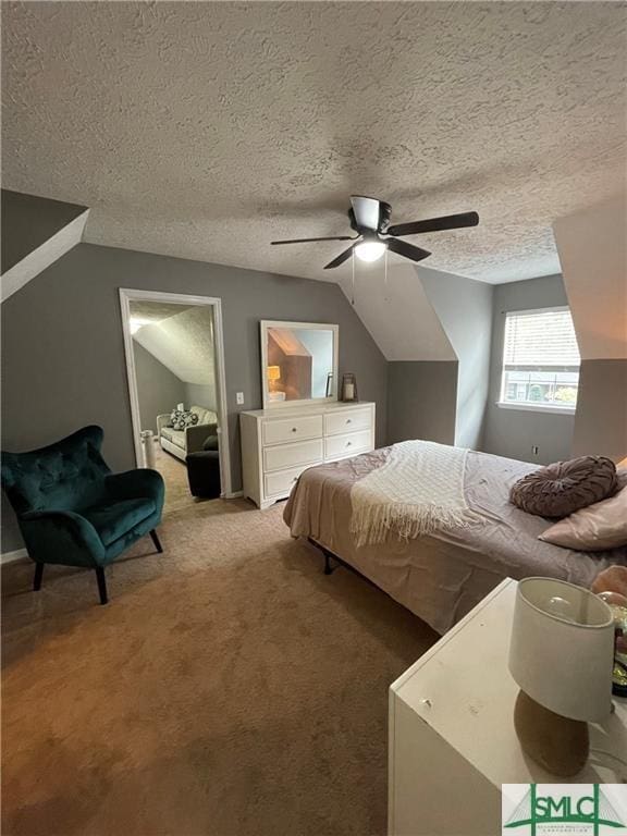 bedroom with lofted ceiling, ceiling fan, a textured ceiling, and carpet flooring