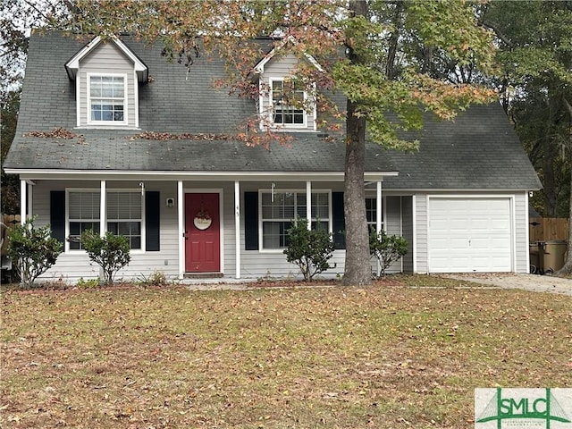 view of front facade featuring a garage, covered porch, and a front yard