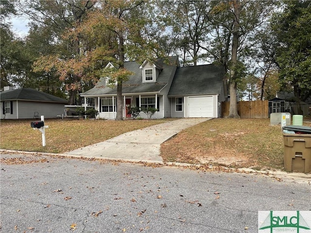 view of front facade with a garage and a front lawn