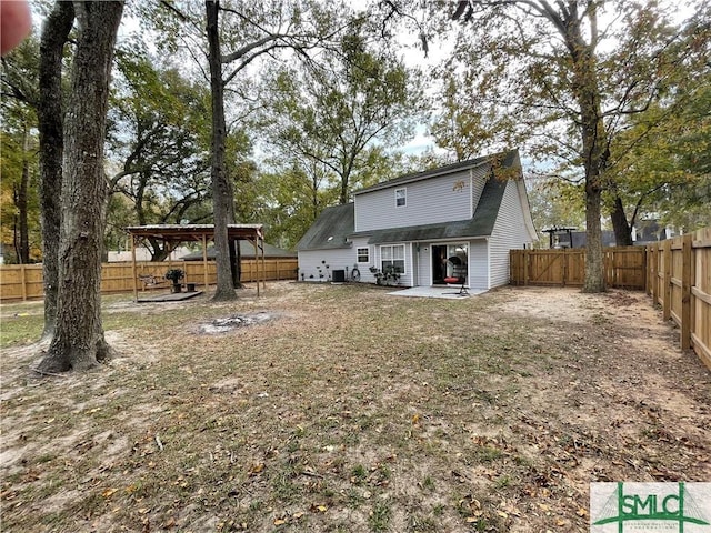 rear view of house with a patio