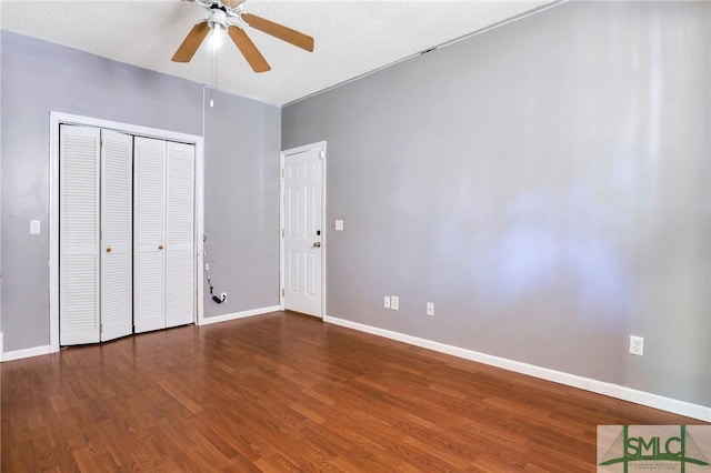 108 Stafford St, Hinesville, GA 31313 - unfurnished bedroom featuring dark wood-type flooring, ceiling fan, and a closet