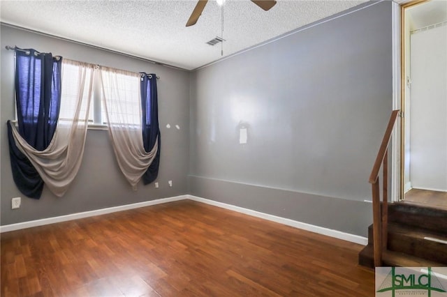 108 Stafford St, Hinesville, GA 31313 - unfurnished room with hardwood / wood-style floors, a textured ceiling, and ceiling fan
