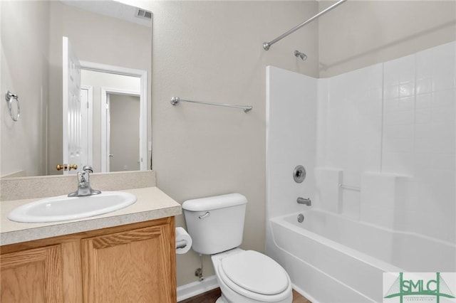 full bathroom with vanity,  shower combination, and toilet