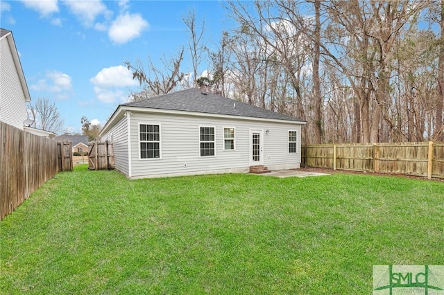 back of property featuring a patio and a lawn