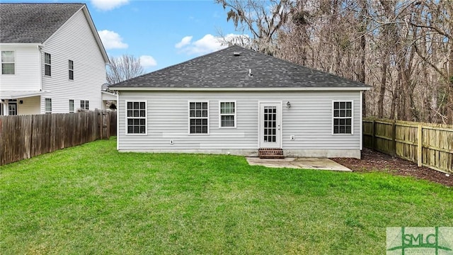 back of property featuring a lawn and a patio area