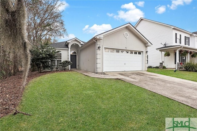 view of front of home with a garage and a front yard